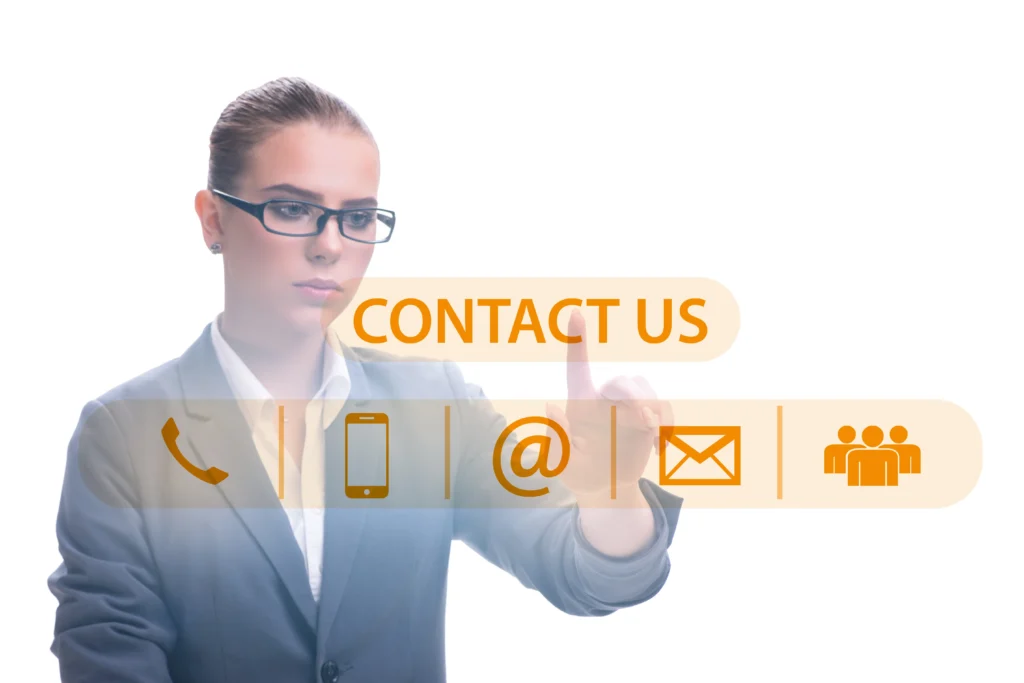 Une femme en tenue de travail interagit avec une interface virtuelle "Contactez-nous" de bekaweb, affichant des icônes de contact pour le téléphone, le mobile, l'e-mail et les options de groupe. Une femme en tenue de travail interagit avec une interface virtuelle "Contactez-nous" de bekaweb, affichant des icônes de contact pour le téléphone, le mobile, l'e-mail et les options de groupe.